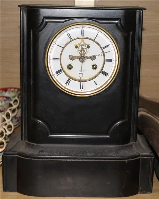 A black marble slate clock and a white marble clock